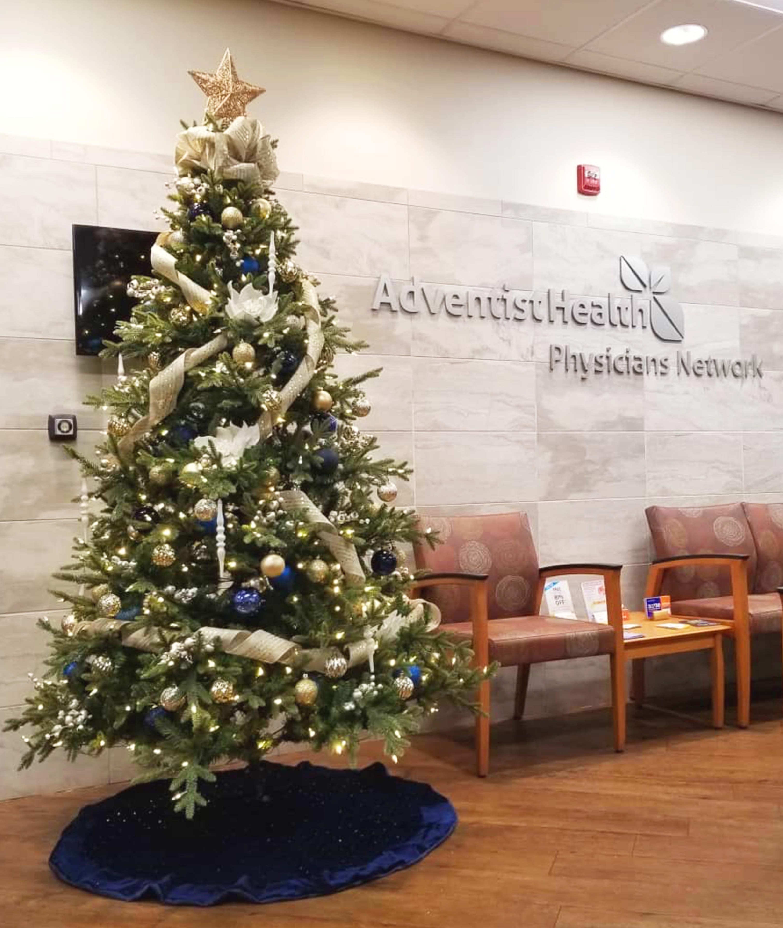 AdventistHealth Physicians Network lobby with gold and blue Christmas tree