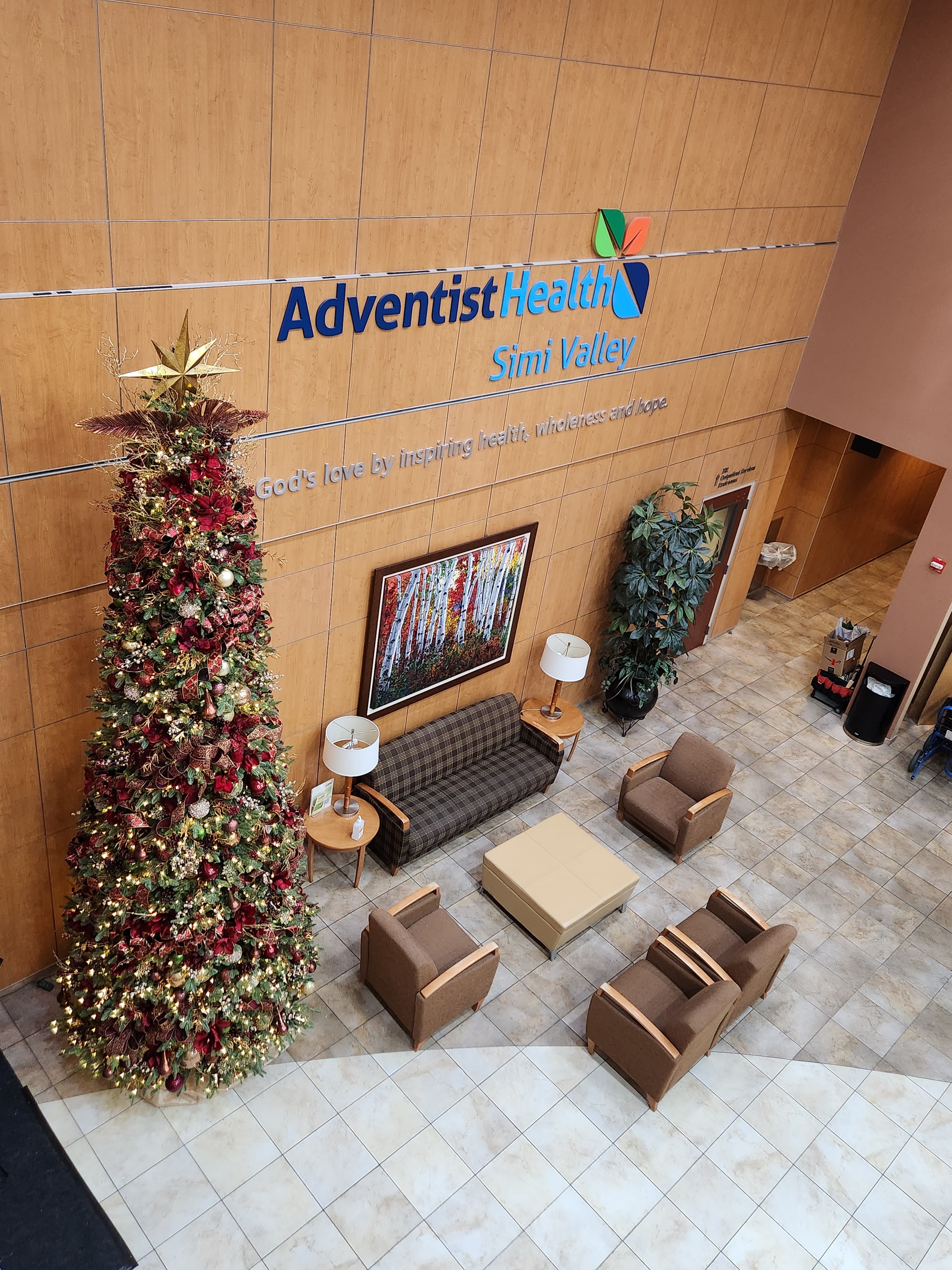 AdventistHealth Simi Valley hospital lobby with red and gold Christmas garland display