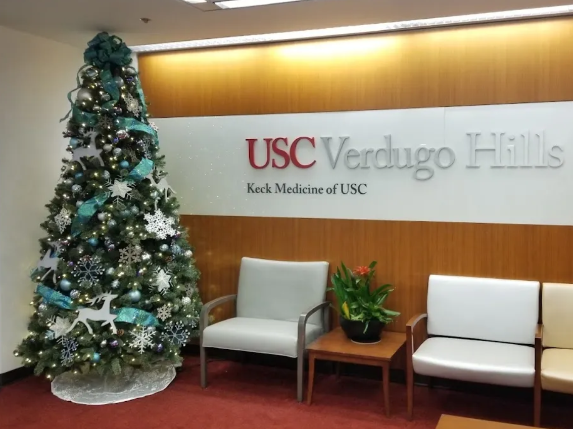 USC Verdugo Hills lobby with teal and silver Christmas tree
